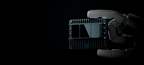 E1R LiDAR held in a humanoid robot hand against a dark background