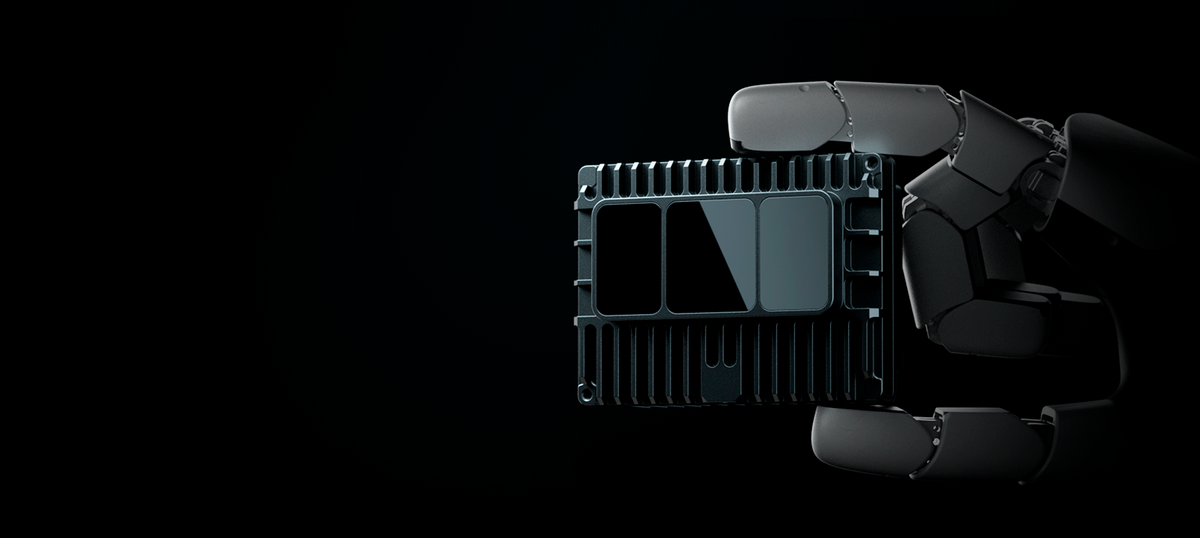 E1R LiDAR held in a humanoid robot hand against a dark background